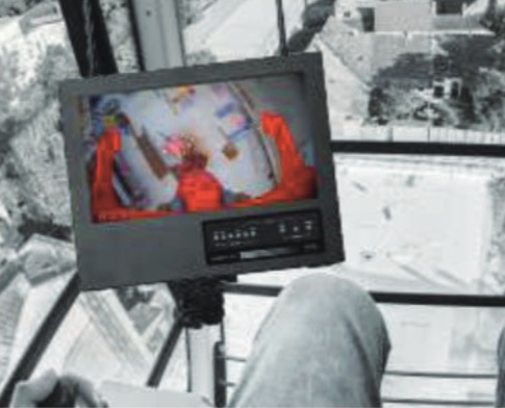 Securely attach the Monitor Console in the cabin’s left corner using the holder clamp.